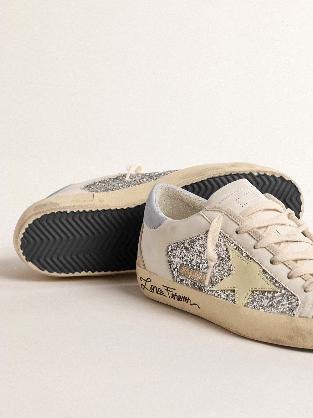 Golden Goose Bio-based Super-Star with silver glitter and yellow leather star