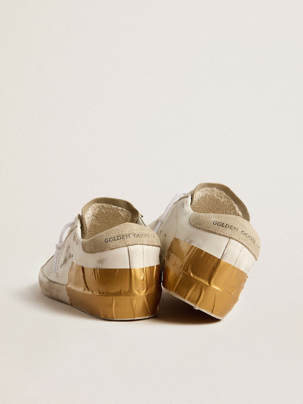 Golden Goose Women's Super-Star LTD in white leather with ice-gray suede inserts and gold-colored tape