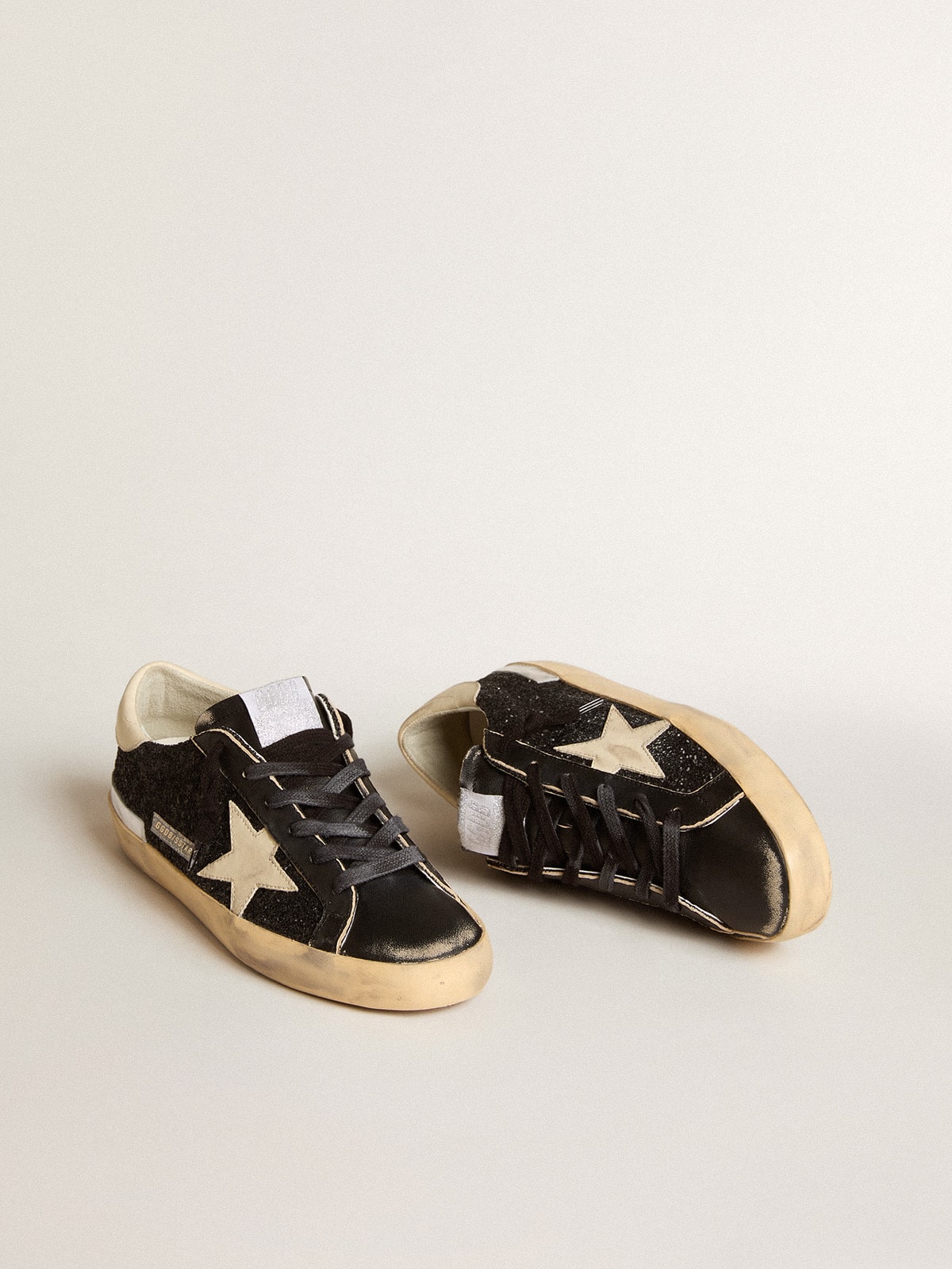 Golden Goose Women's Super-Star in black glitter and nappa with cream leather star and heel tab