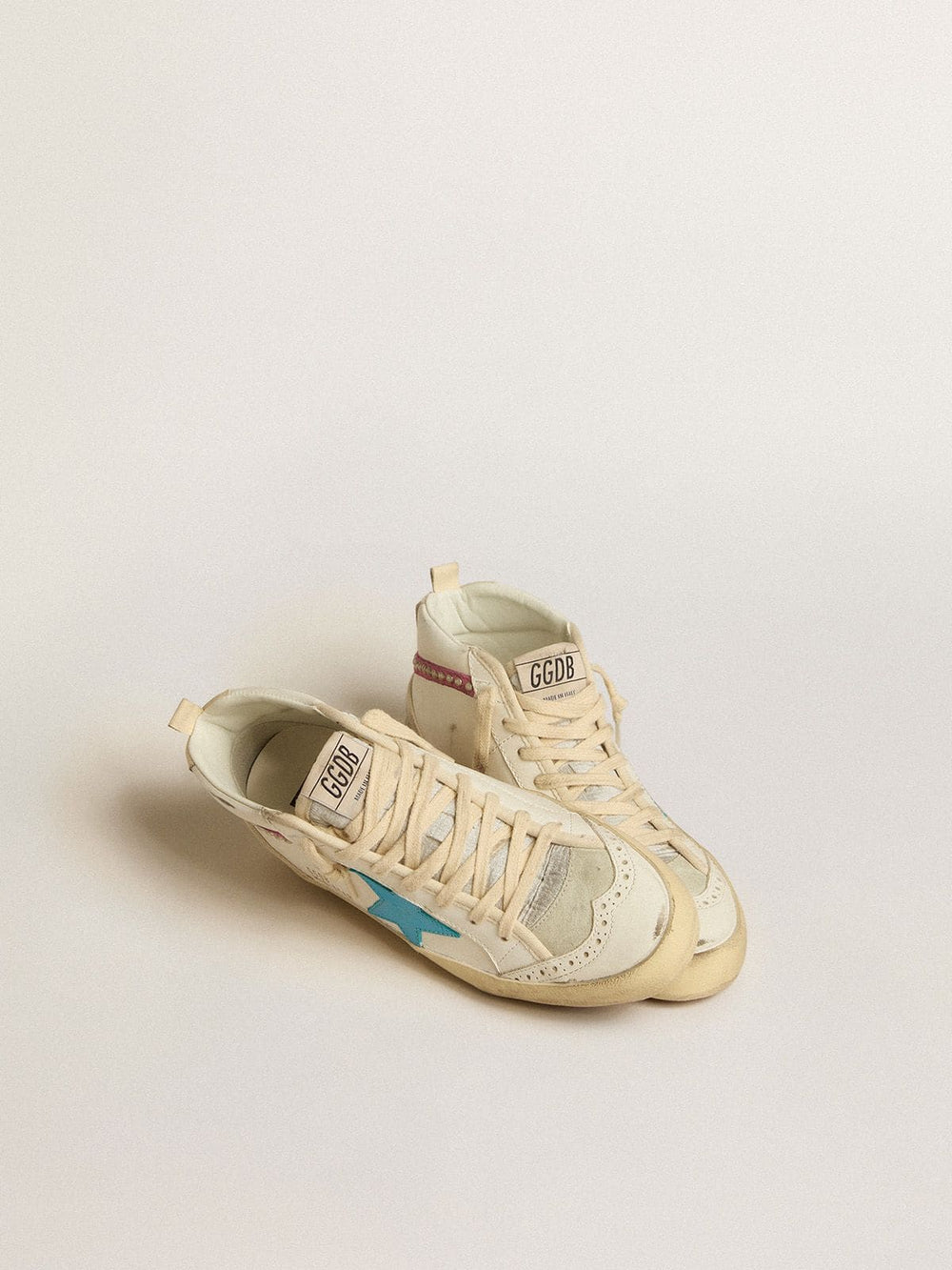 Golden Goose Women's Mid Star in leather with light blue star and fuchsia suede flash with platinum studs