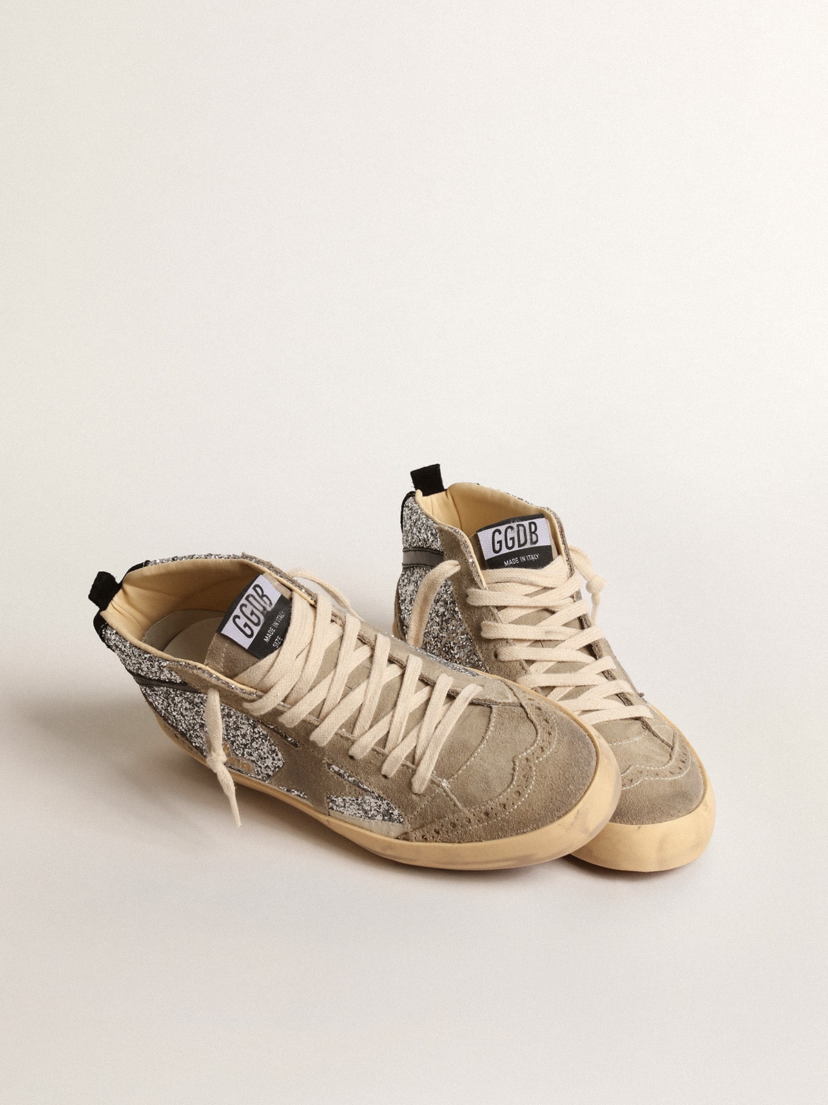 Golden Goose Mid Star in silver glitter with suede star and black flash