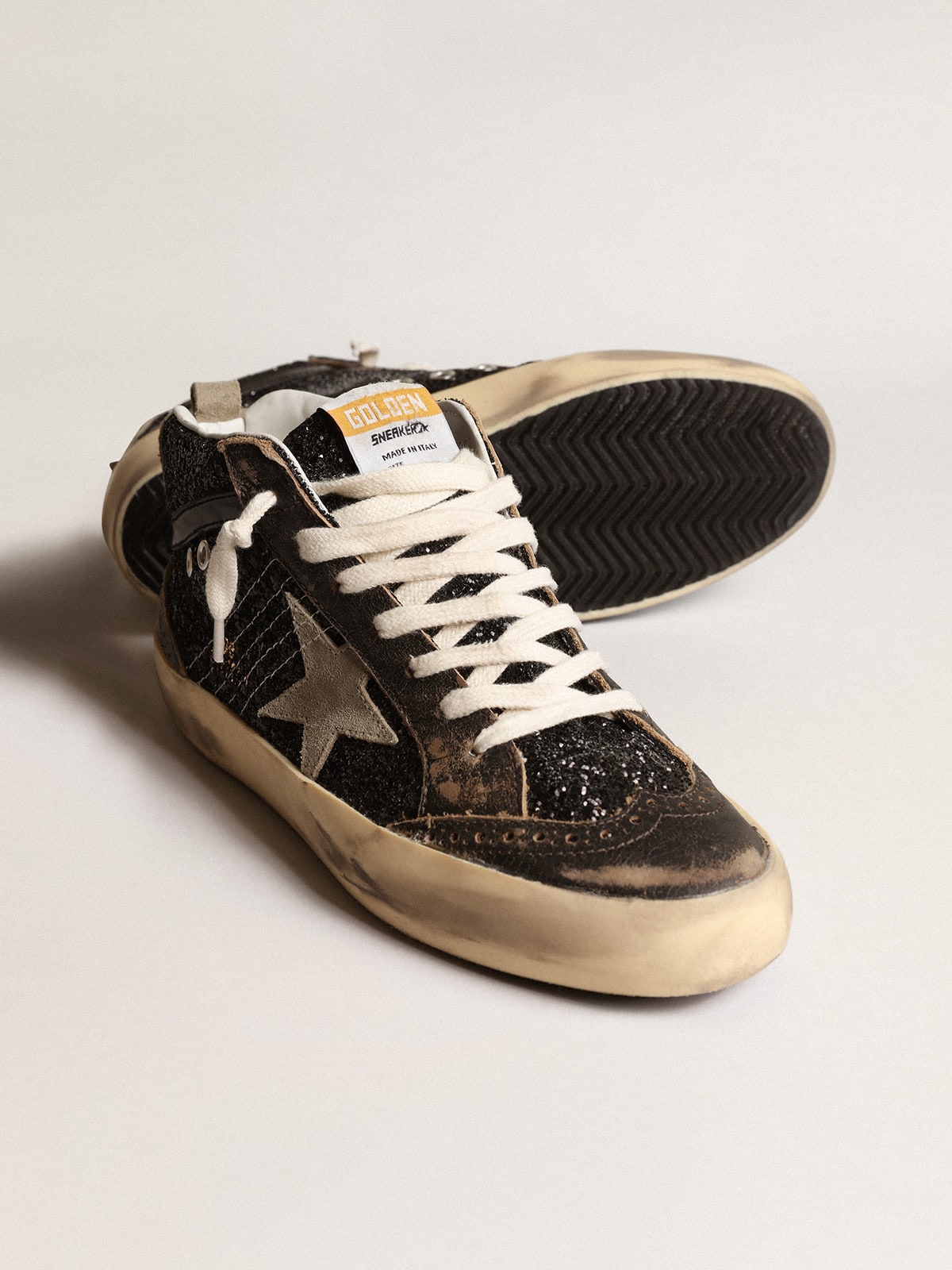 Golden Goose Women’s Mid Star in black glitter with dove-gray suede star and heel tab
