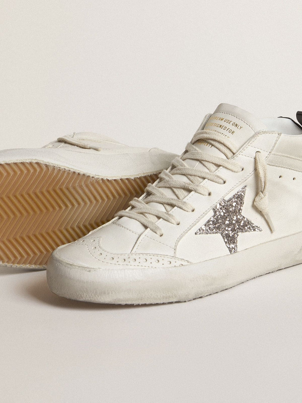 Golden Goose Women's Mid Star with silver glitter star and black laminated heel tab