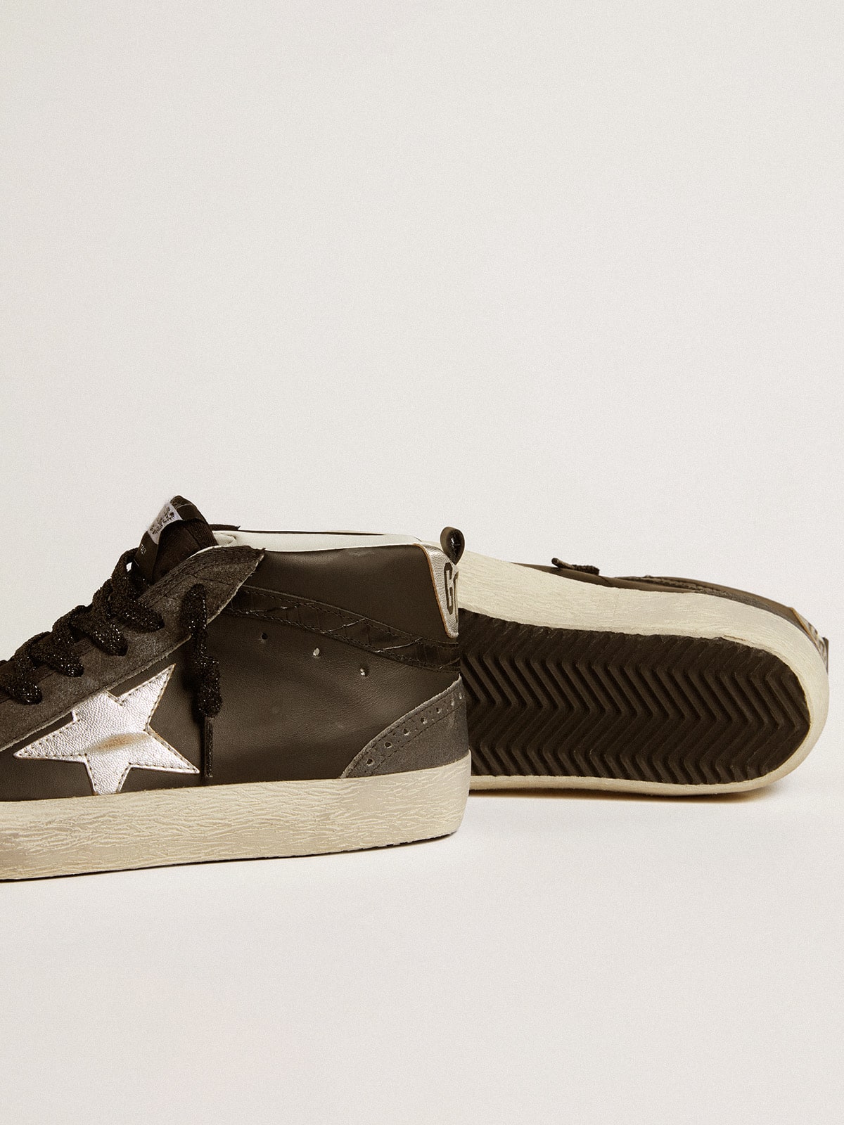 Golden Goose Women’s Mid Star in black leather with silver metallic leather star