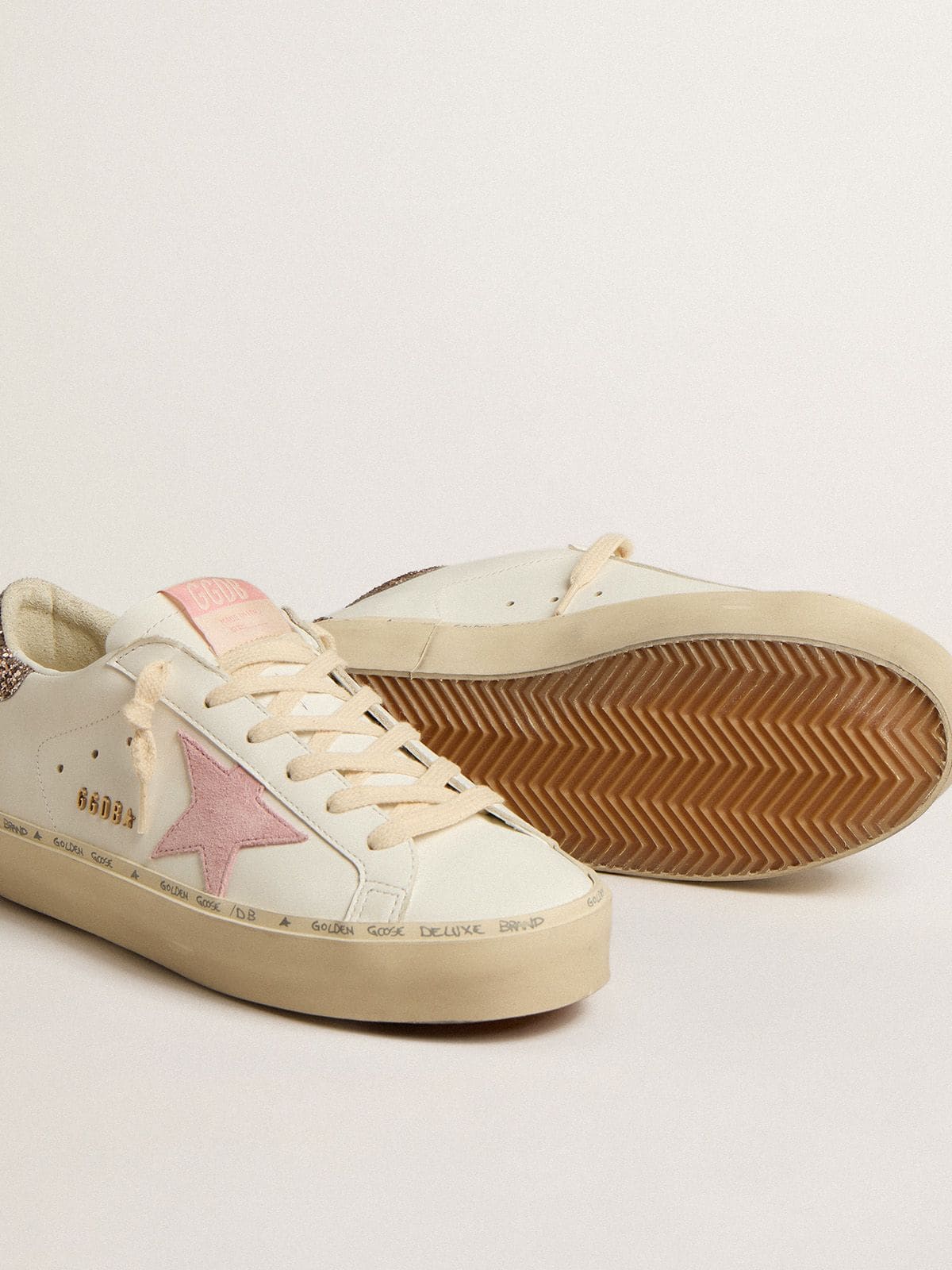 Golden Goose Hi Star in white leather with pink suede star and pink glitter heel tab
