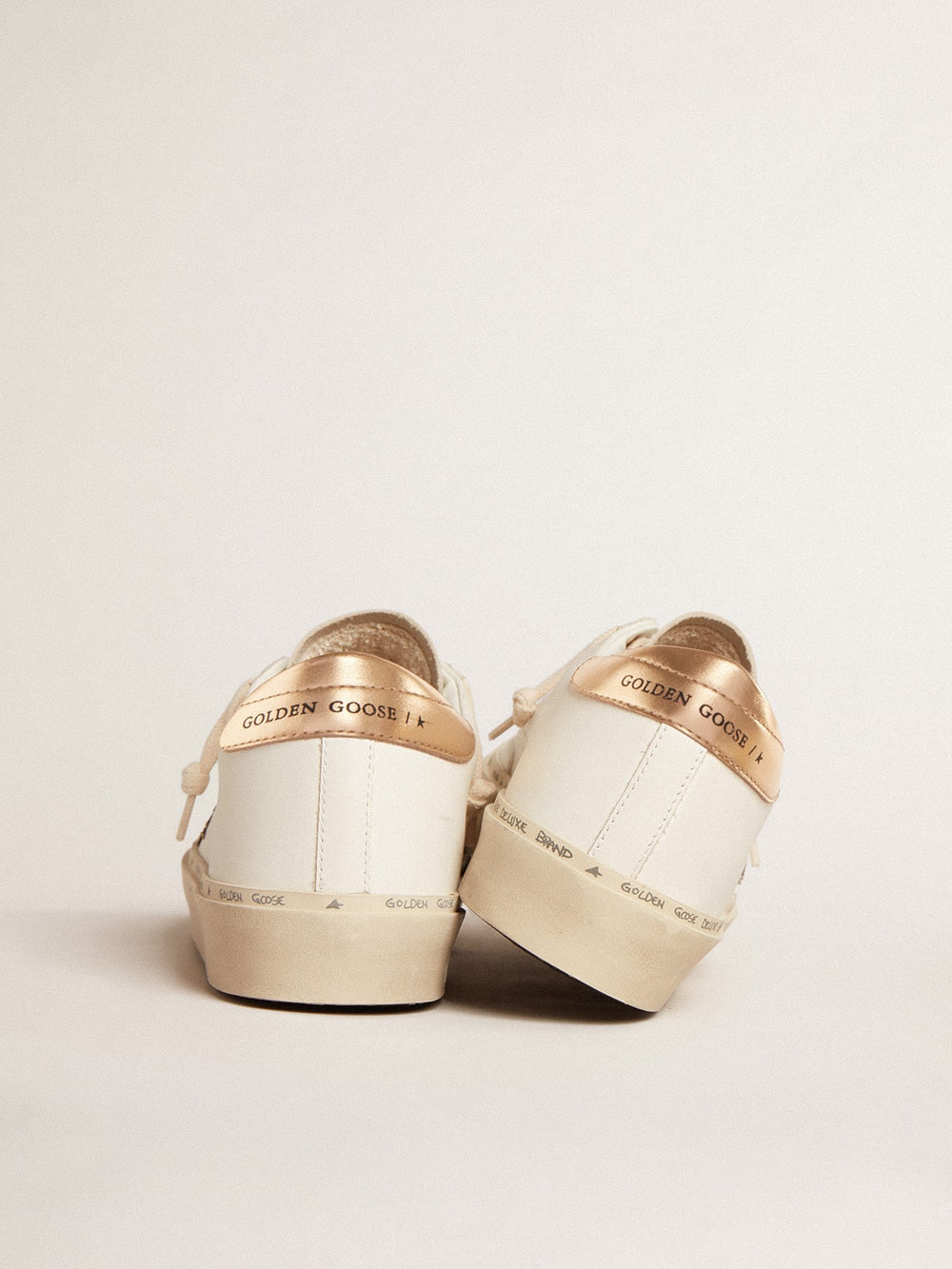 Golden Goose Hi Star  with black and gold glitter star and gold heel tab