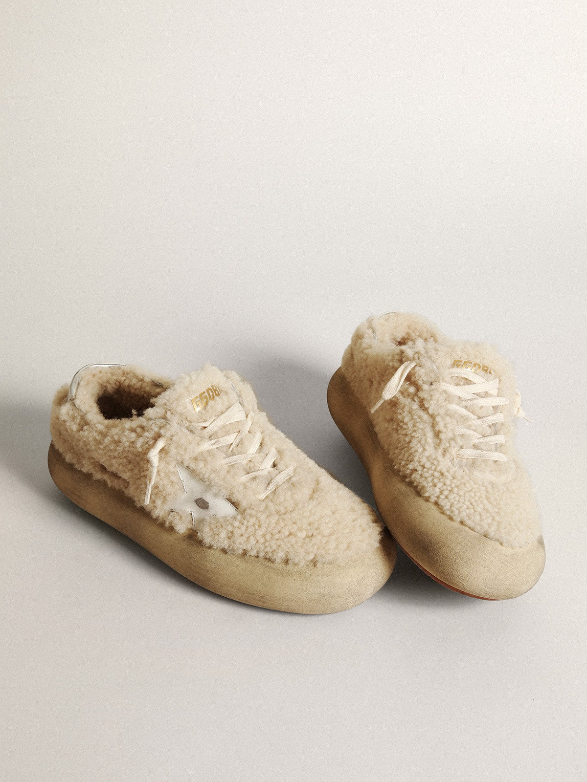 Golden Goose Women’s Space-Star shoes in beige shearling with white leather star and metallic leather heel tab