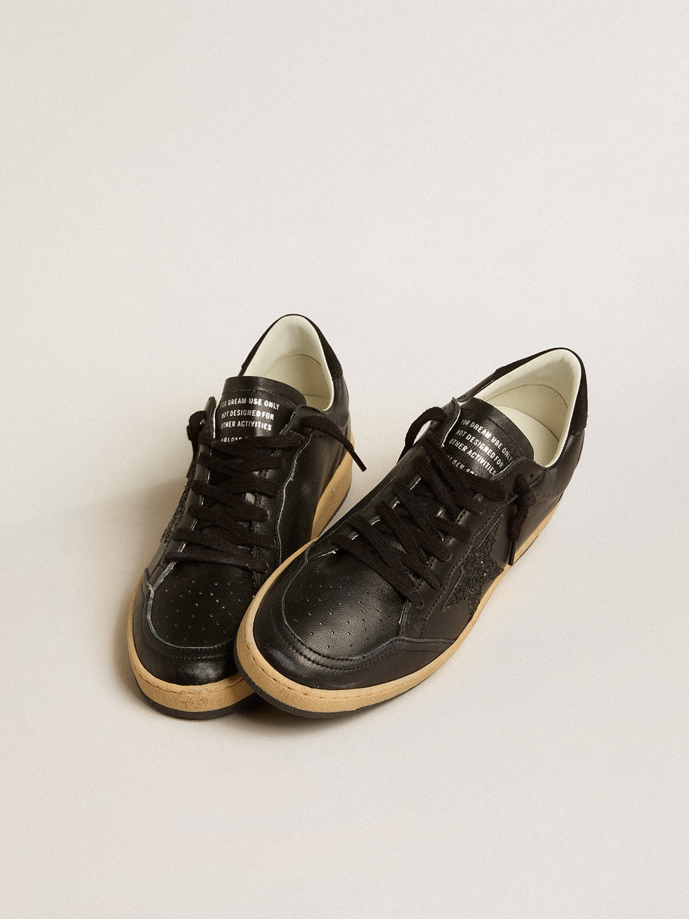 Golden Goose Women’s Ball Star in black nappa with black glitter star and suede heel tab