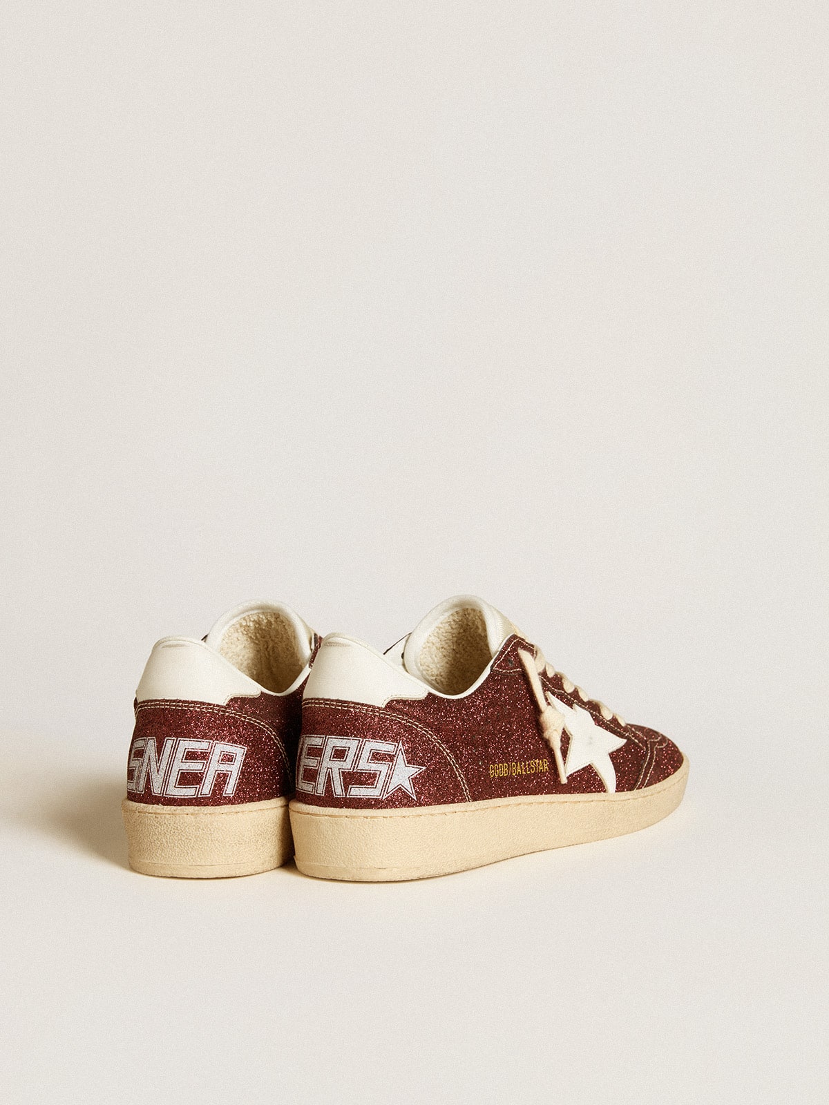 Golden Goose Ball Star in burgundy glitter with white leather star and heel tab