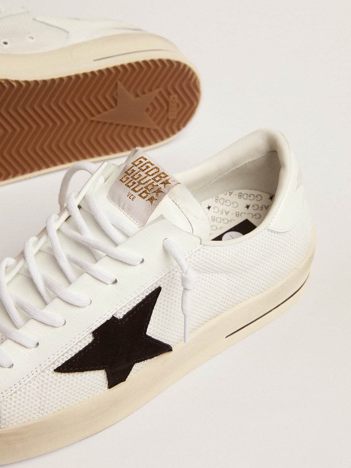Golden Goose Stardan with white leather and mesh inserts and black suede star