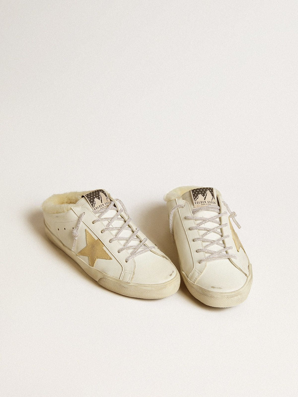 Golden Goose Women’s Super-Star Sabots with gold suede star and shearling lining