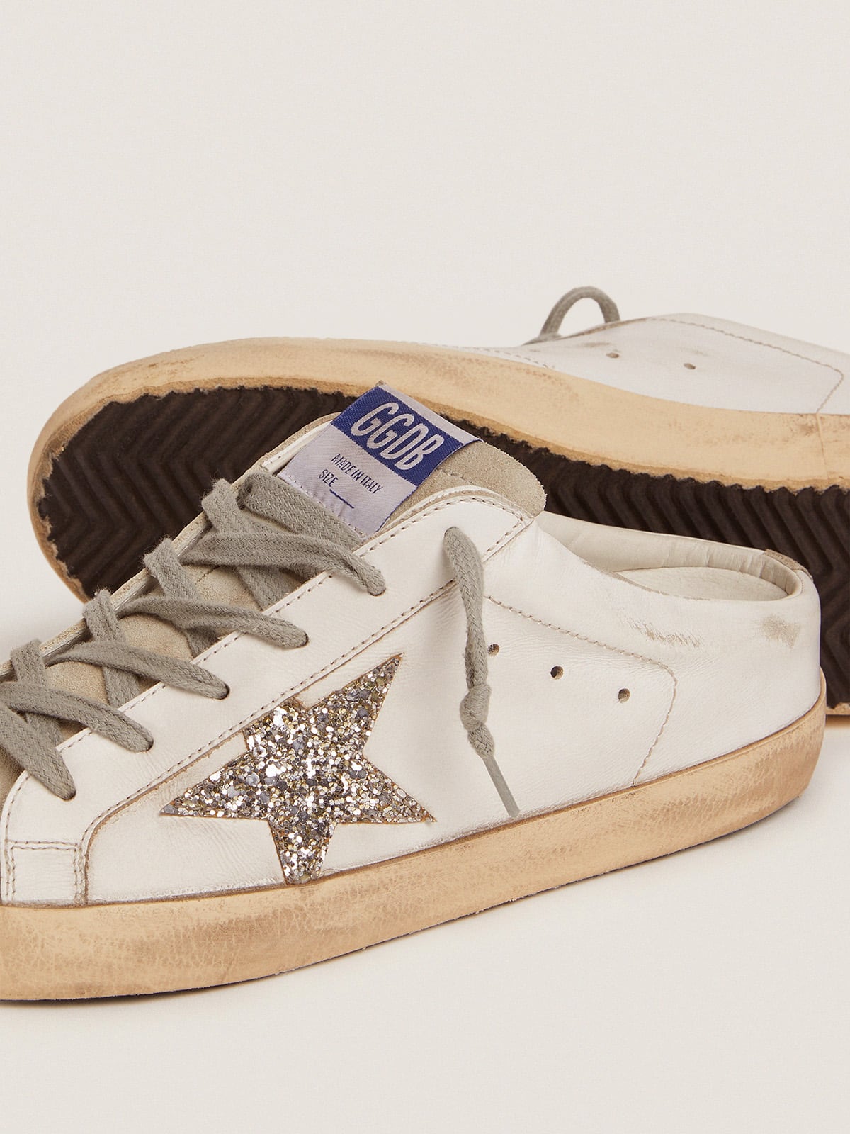 Golden Goose Super-Star Sabot with a platinum glitter star and suede tongue