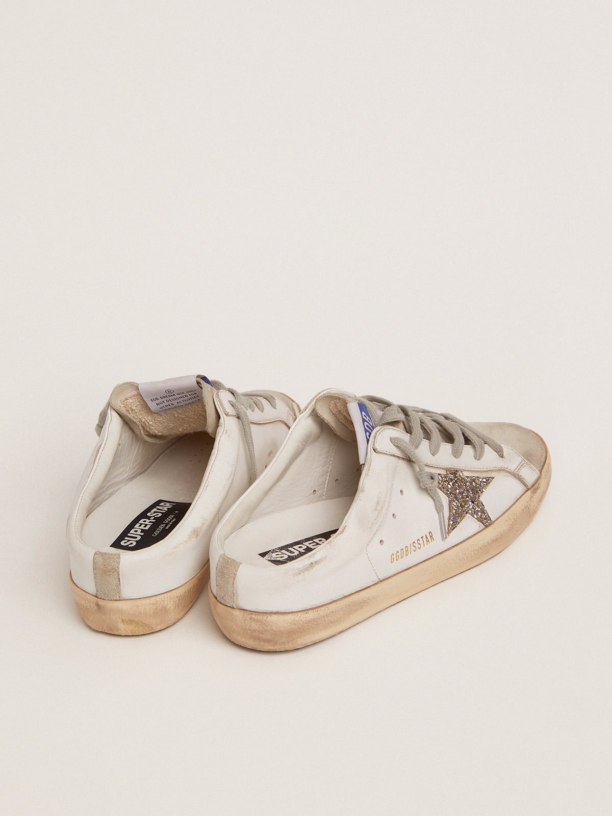 Golden Goose Super-Star Sabot with a platinum glitter star and suede tongue