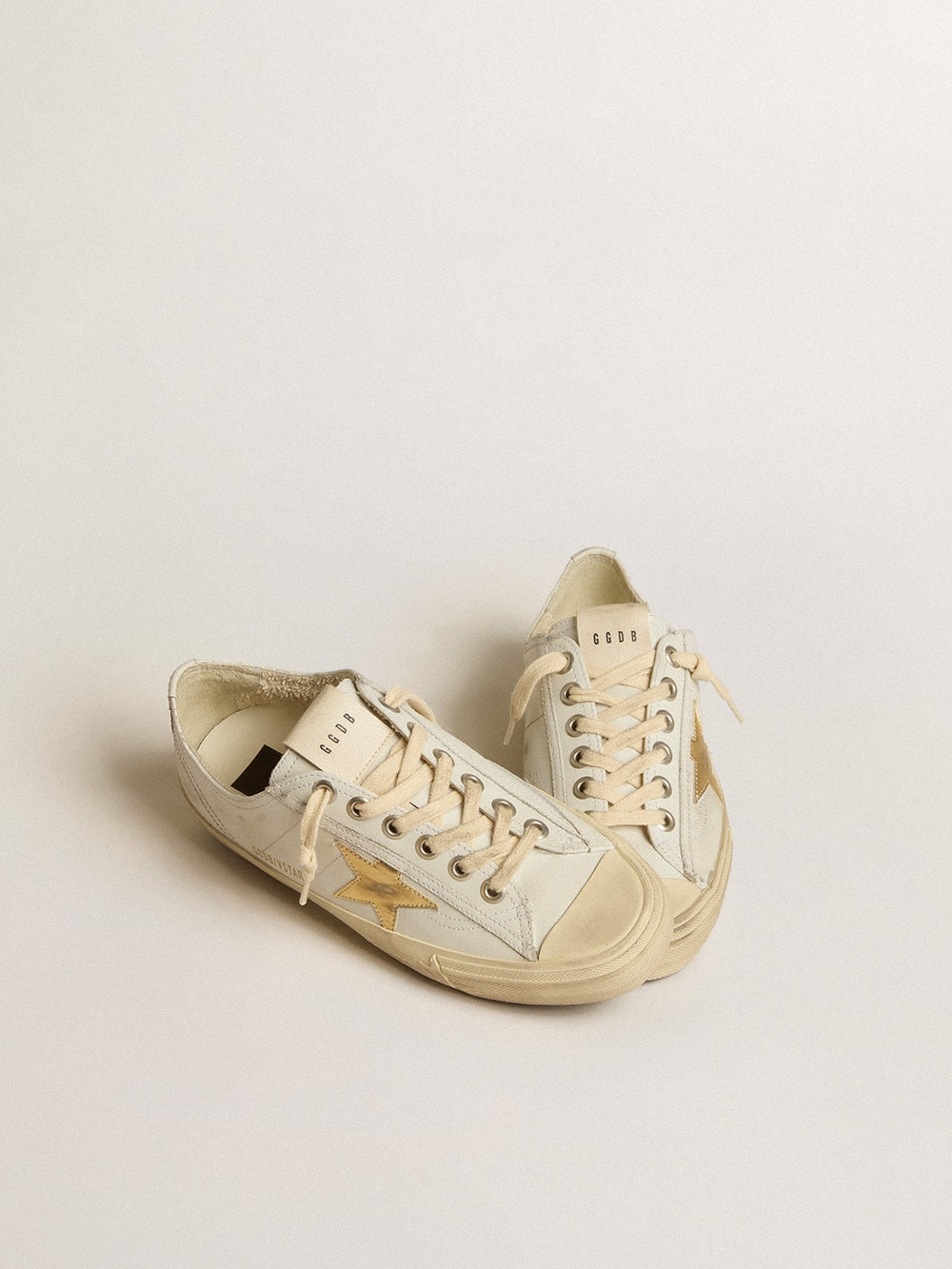 Golden Goose V-Star in white leather with gold metallic leather star
