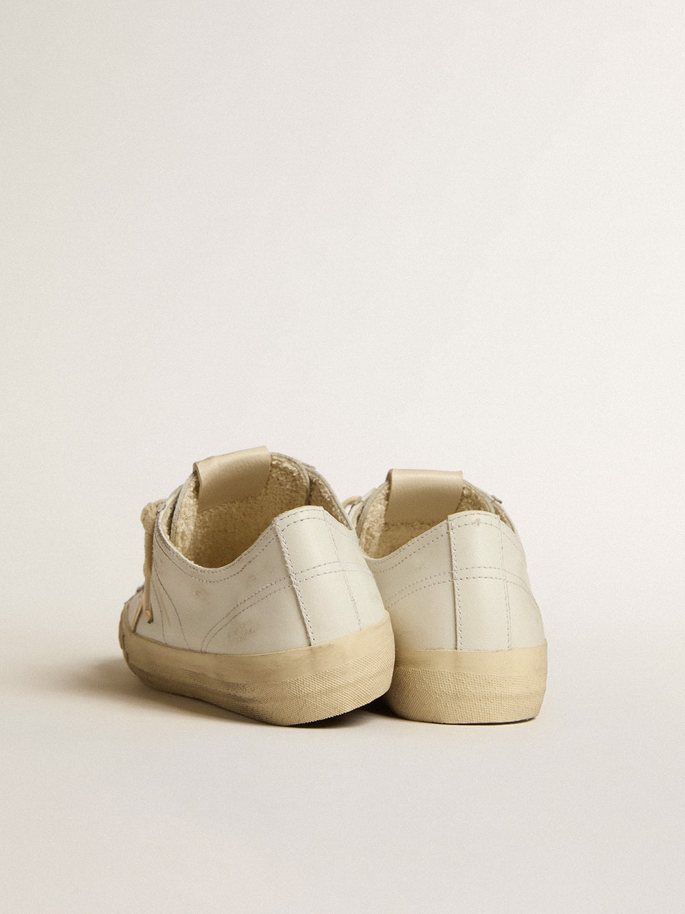 Golden Goose V-Star in white leather with gold metallic leather star