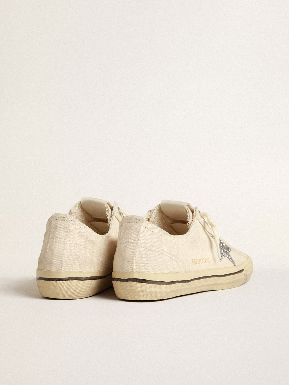 Golden Goose V-Star in beige canvas with a silver glitter star