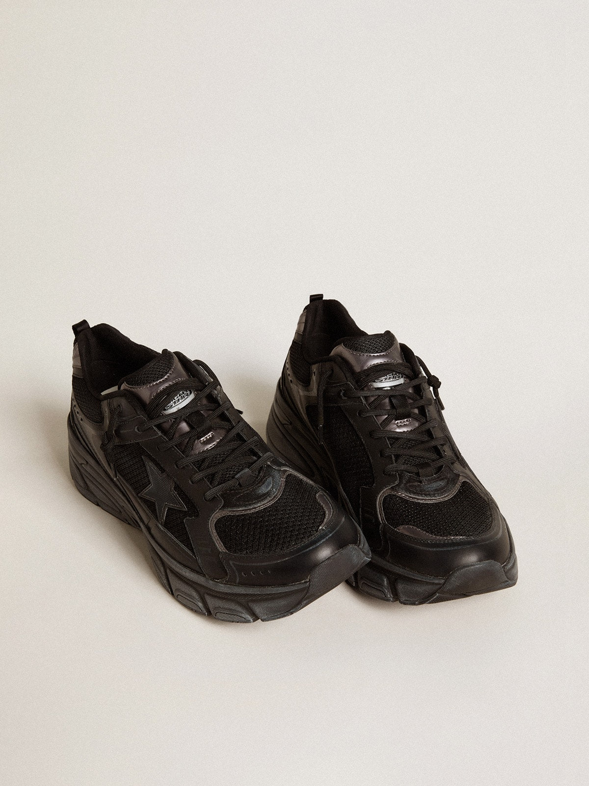 Golden Goose Women’s Lightstar with black leather and mesh upper and black star