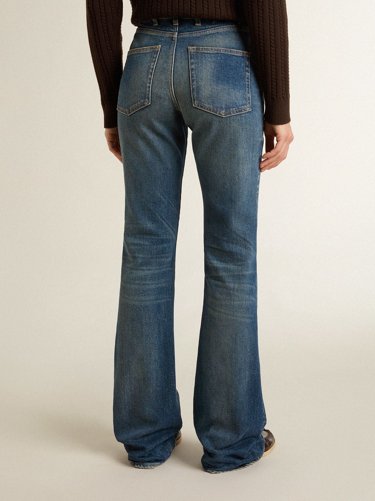 Golden Goose Women's bootcut jeans with a vintage wash and metallic details