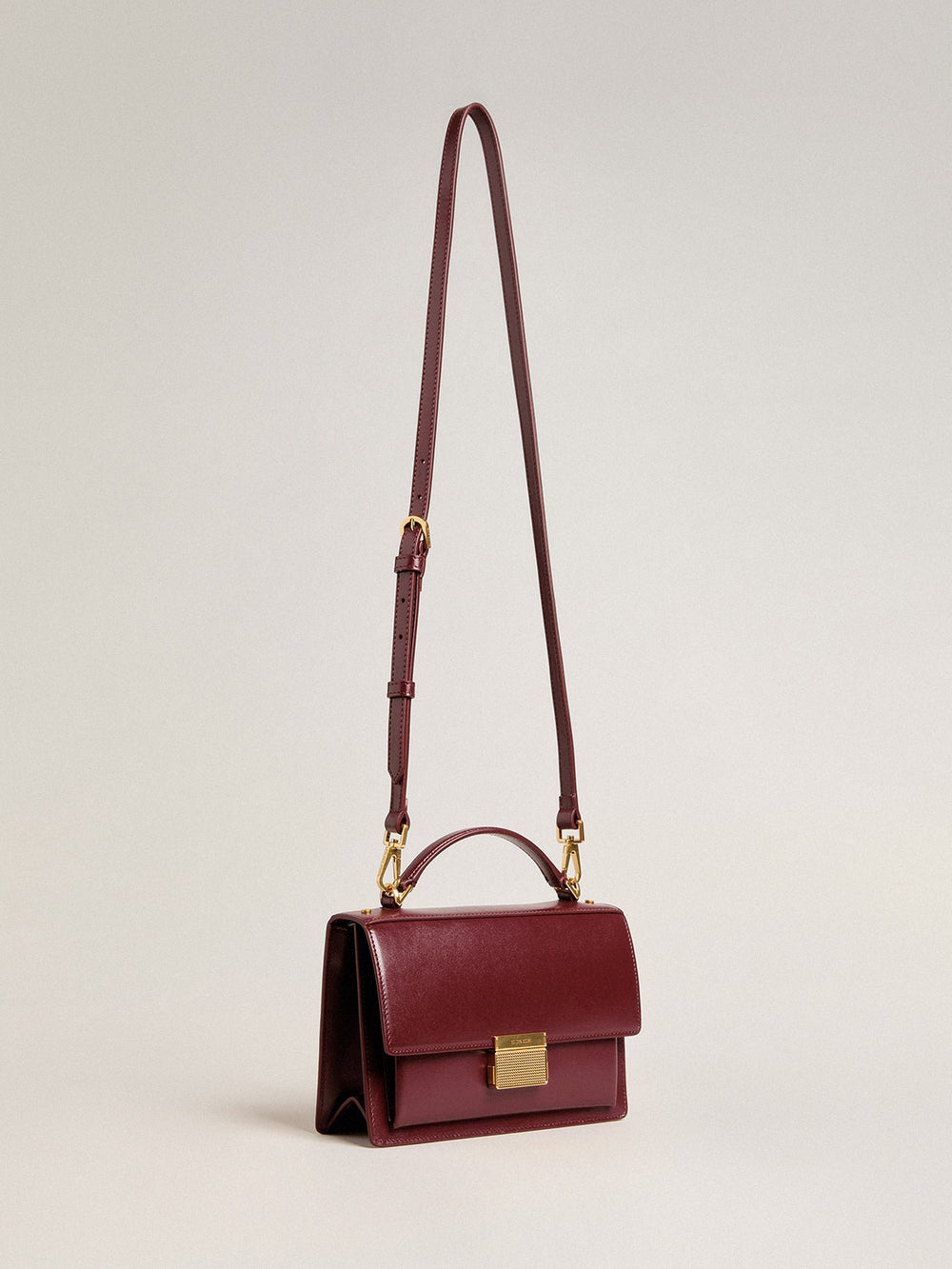 Golden Goose Venezia Bag in burgundy boarded leather with gold details