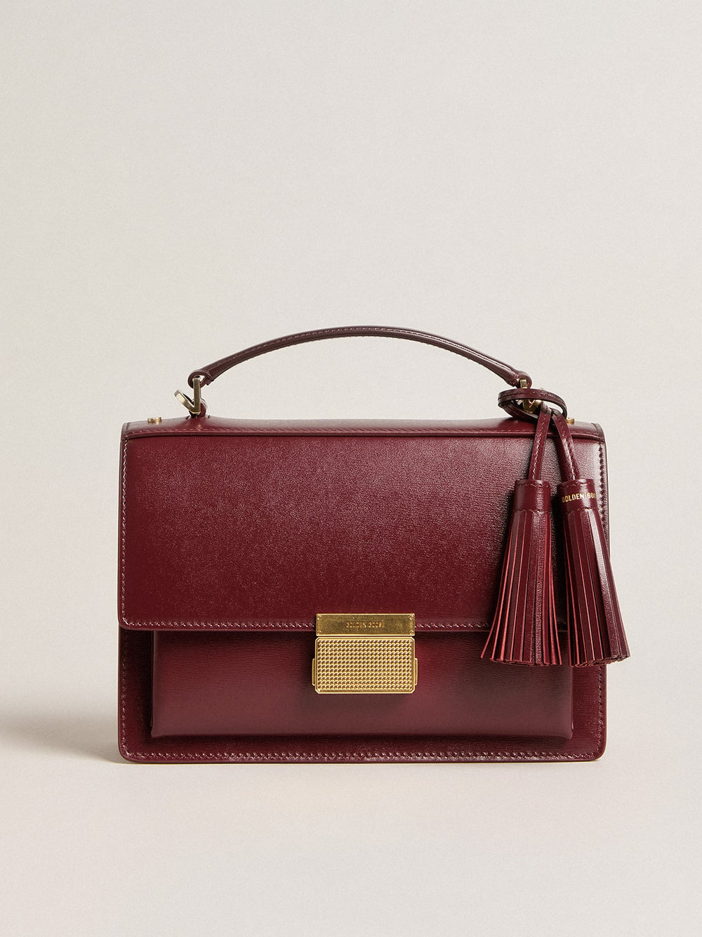 Golden Goose Venezia Bag in burgundy boarded leather with gold details