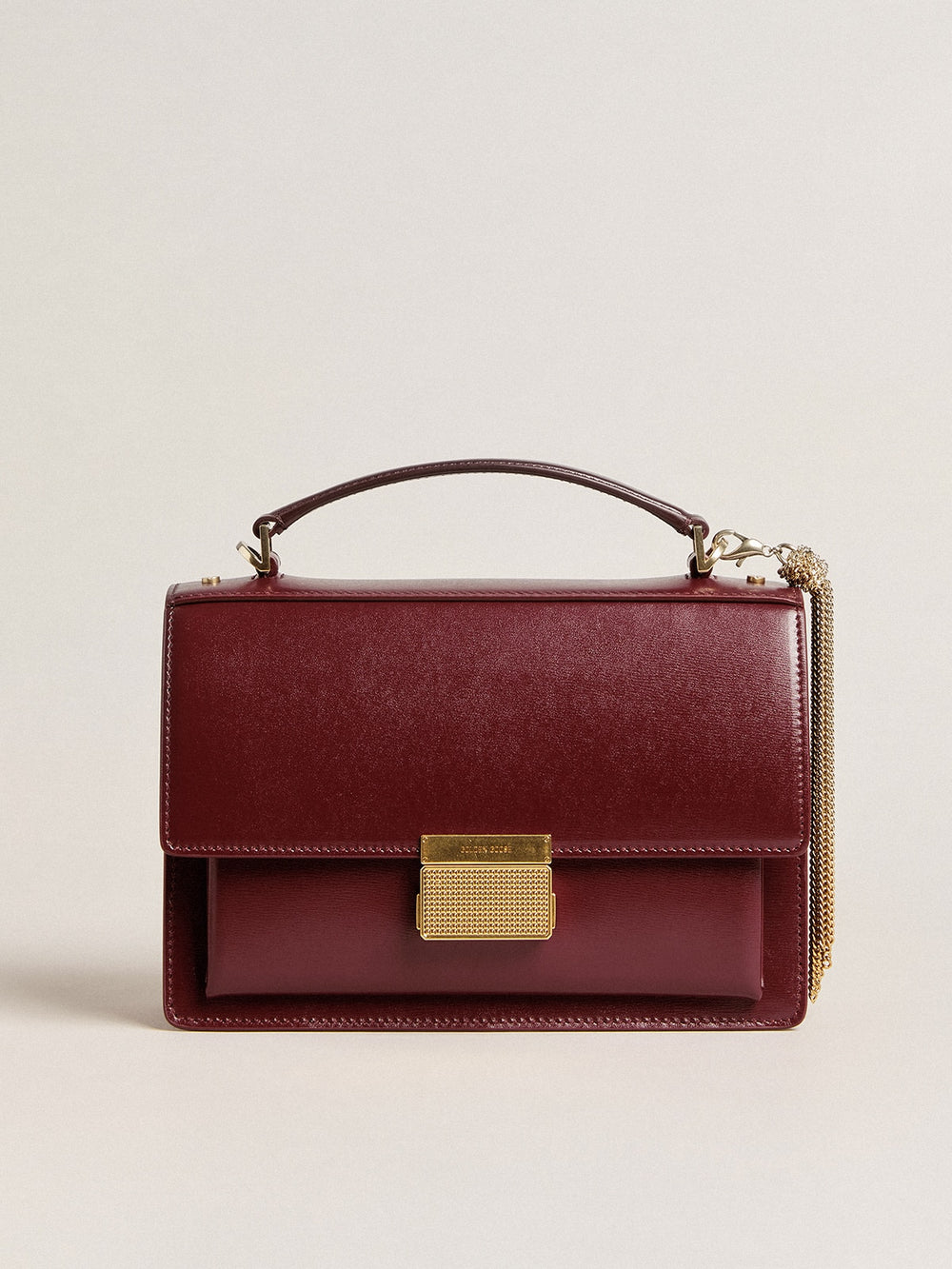 Golden Goose Venezia Bag in burgundy boarded leather with gold details