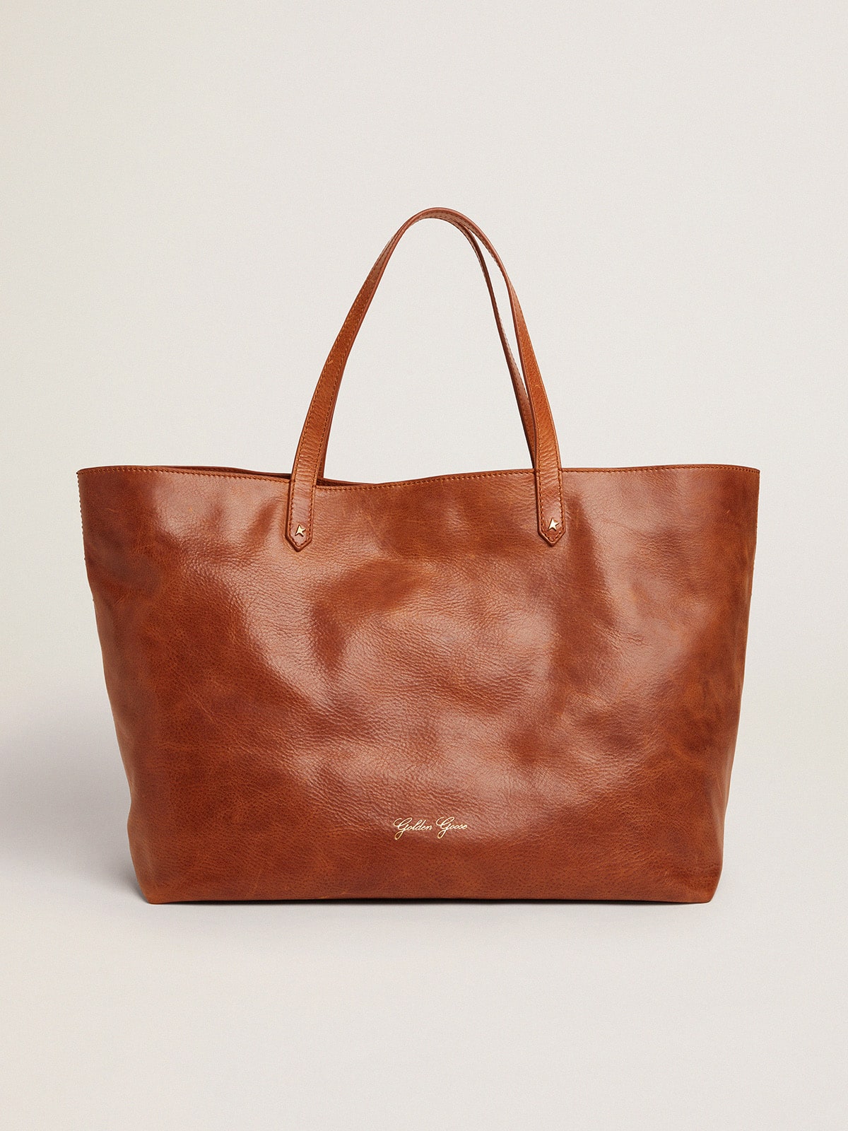 Golden Goose Pasadena Bag in tan-colored glossy hammered leather with gold logo on the front