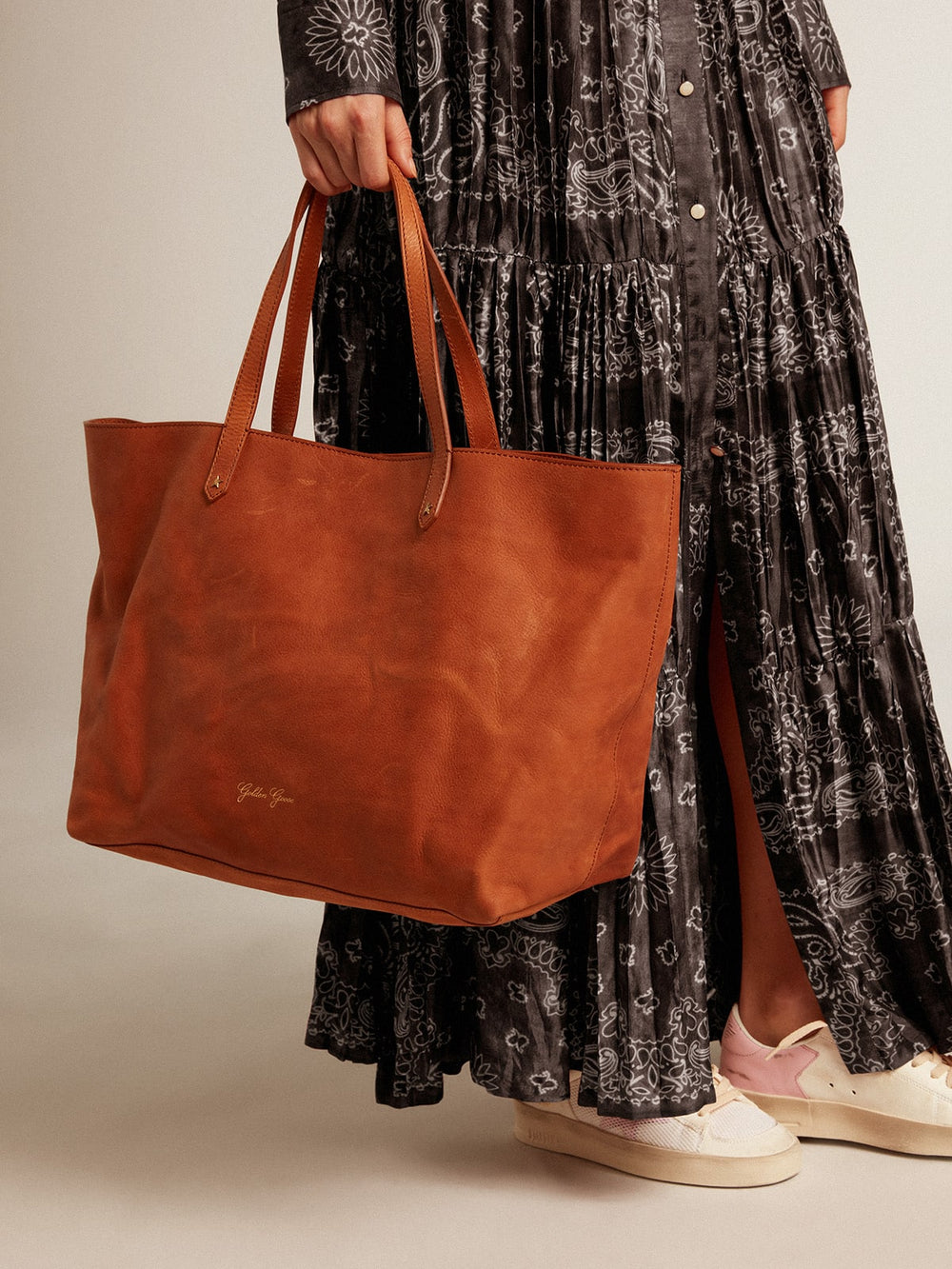 Golden Goose Pasadena Bag in tan-colored glossy hammered leather with gold logo on the front