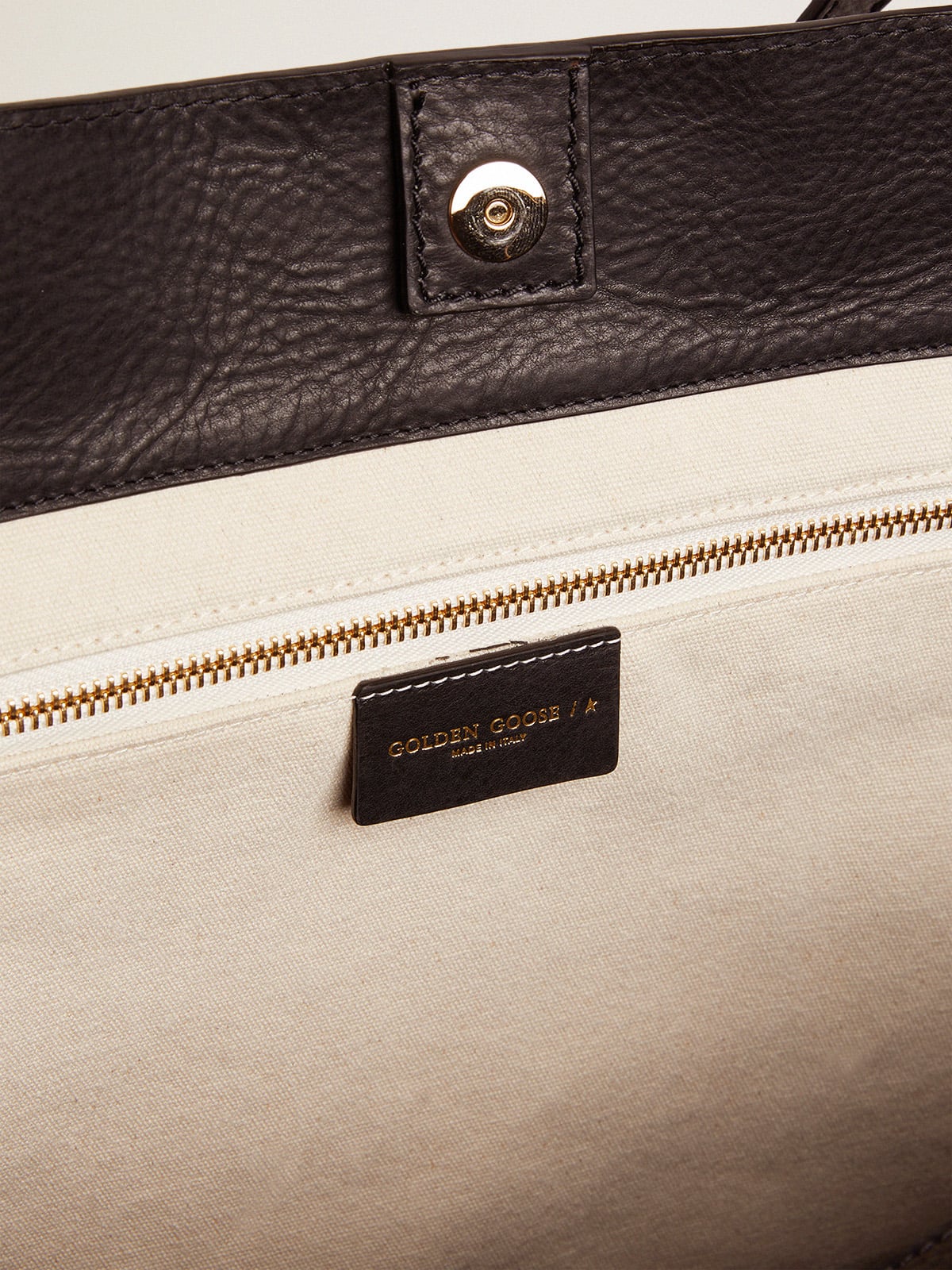 Golden Goose Pasadena Bag in black hammered leather with gold logo on the front