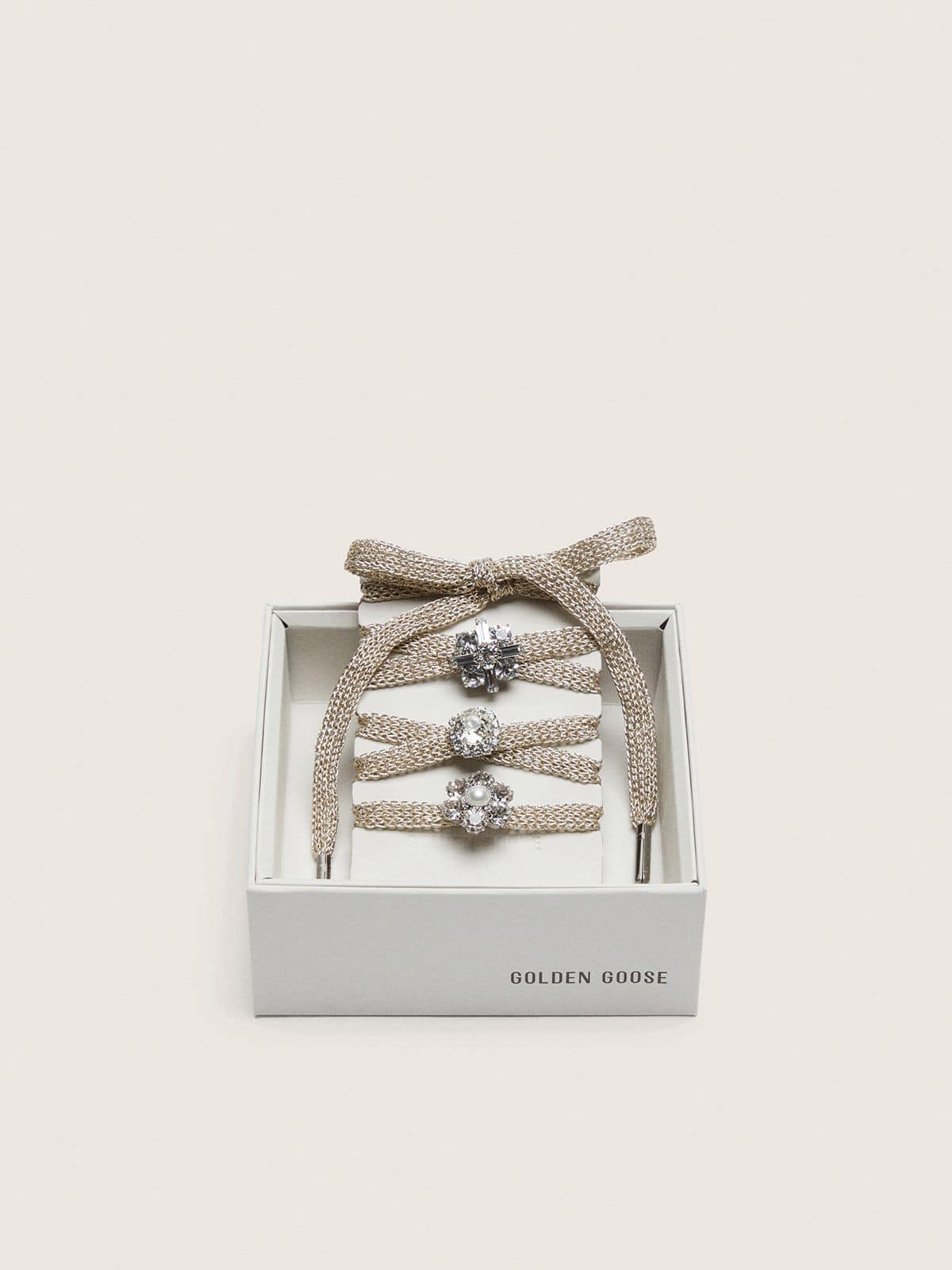 Golden Goose Skins braided gold-colored laces with shimmering charms