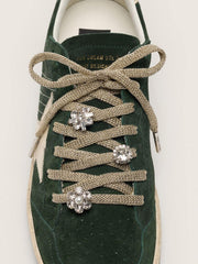Golden Goose Skins braided gold-colored laces with shimmering charms