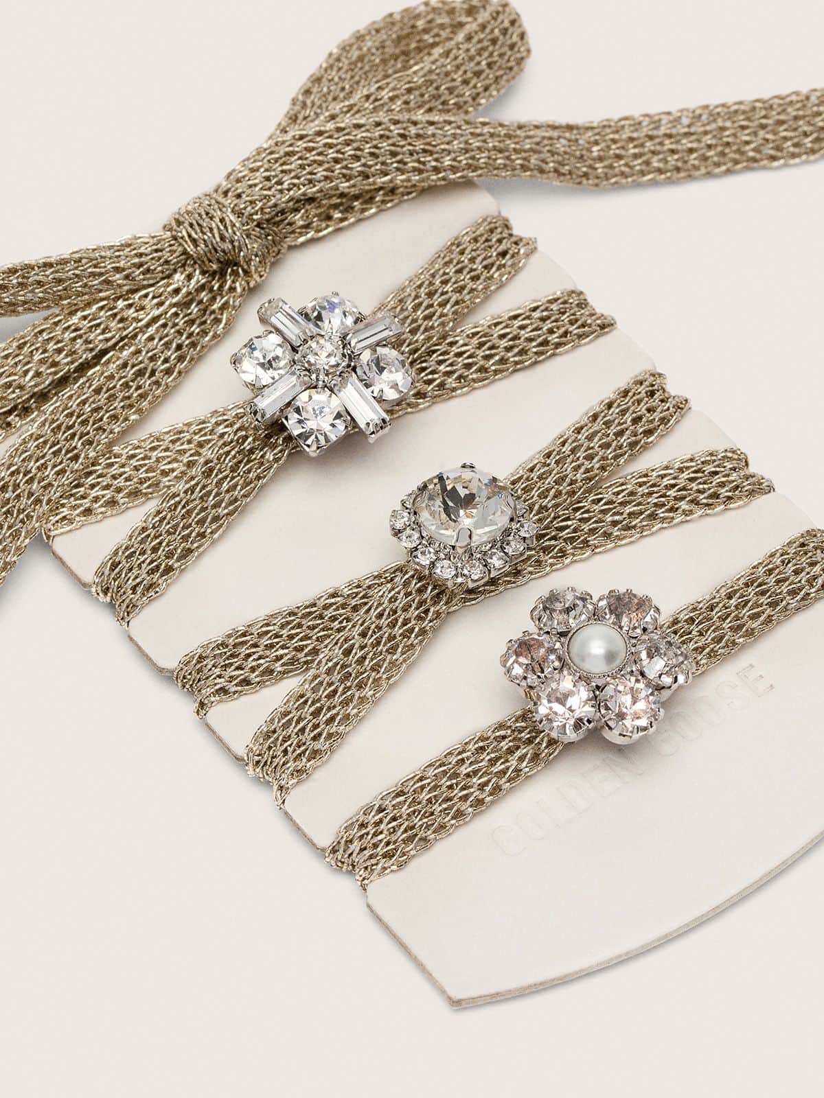 Golden Goose Skins braided gold-colored laces with shimmering charms