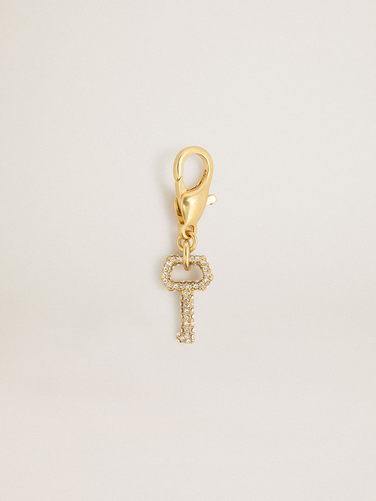 Golden Goose Key-shaped charm in gold-colored brass with crystals