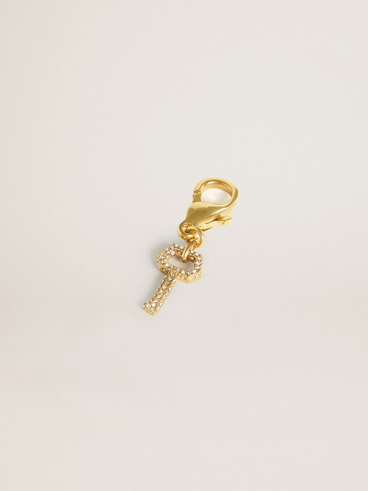 Golden Goose Key-shaped charm in gold-colored brass with crystals