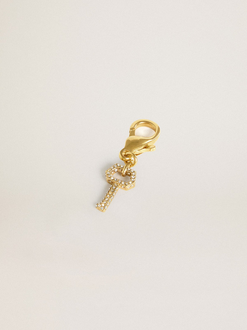 Golden Goose Key-shaped charm in gold-colored brass with crystals