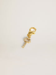Golden Goose Key-shaped charm in gold-colored brass with crystals
