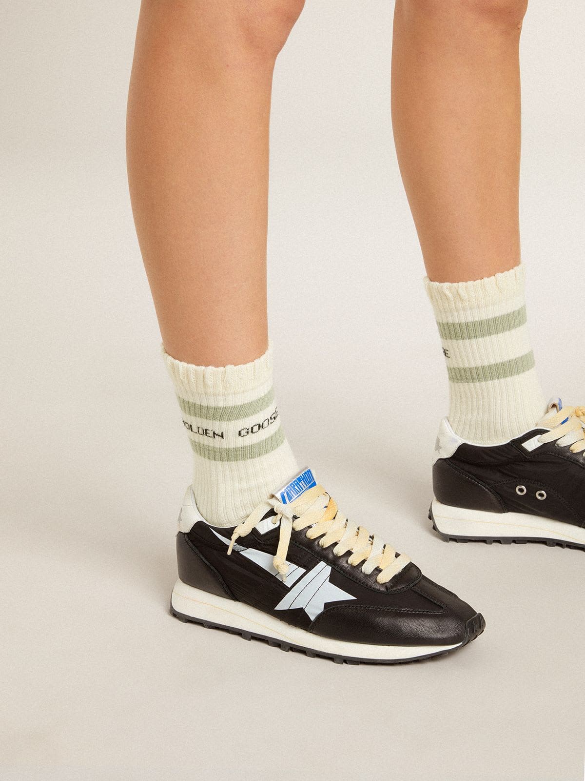 Golden Goose Worn-white socks with distressed details and sage-green stripes