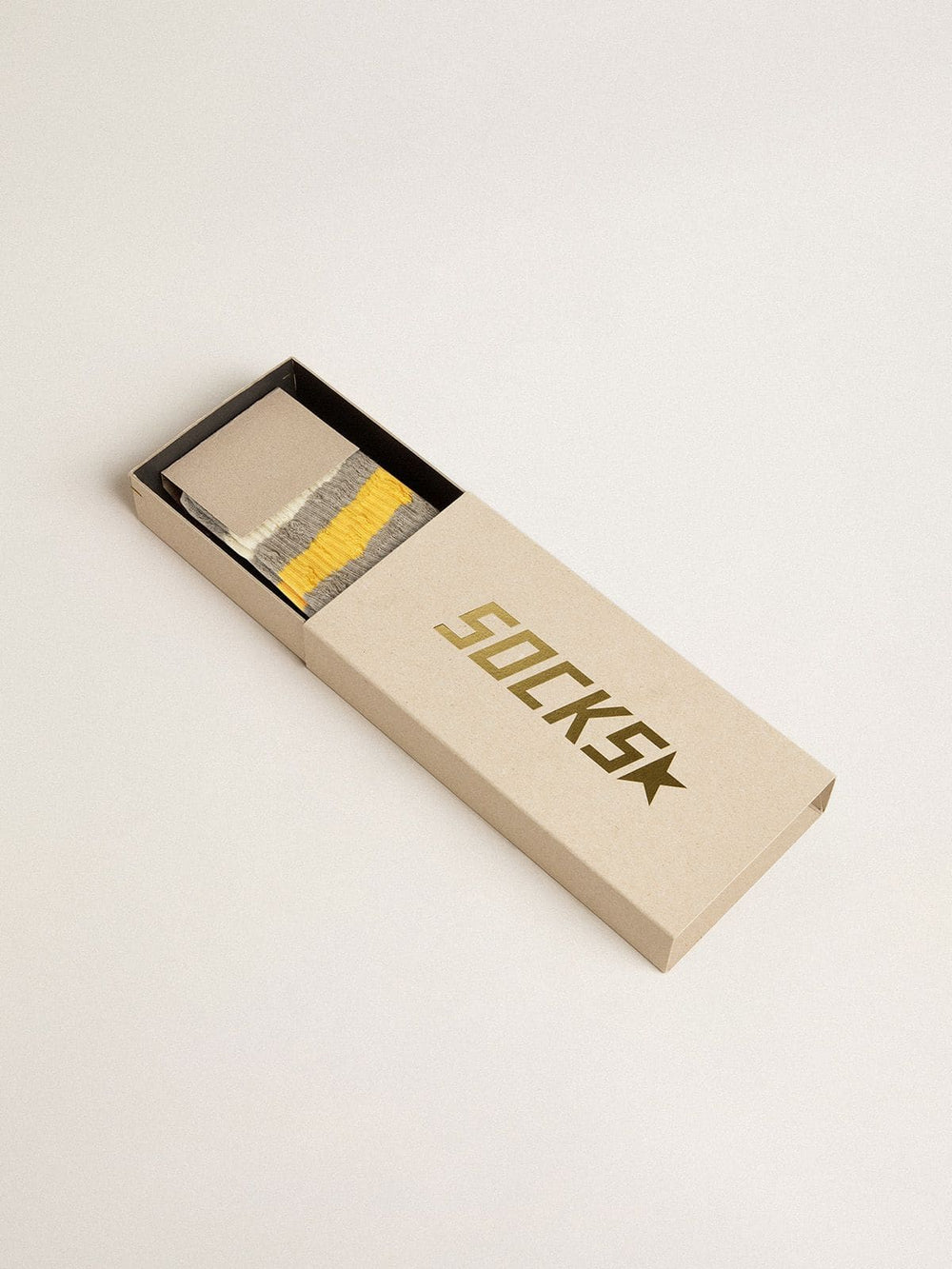 Golden Goose Gray socks with distressed details and yellow and white stripes