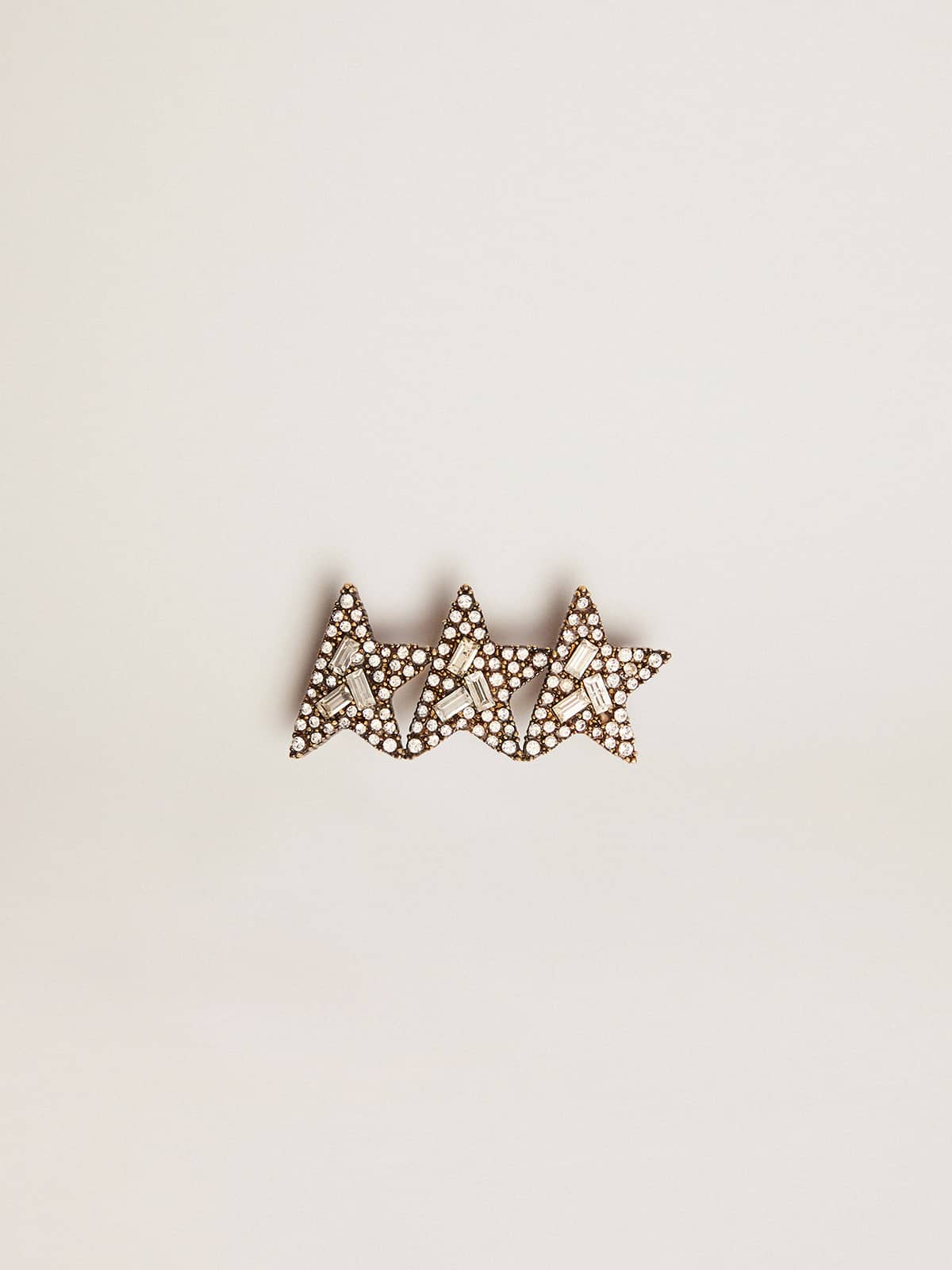 Golden Goose Lace accessory with three antique gold color stars with crystals