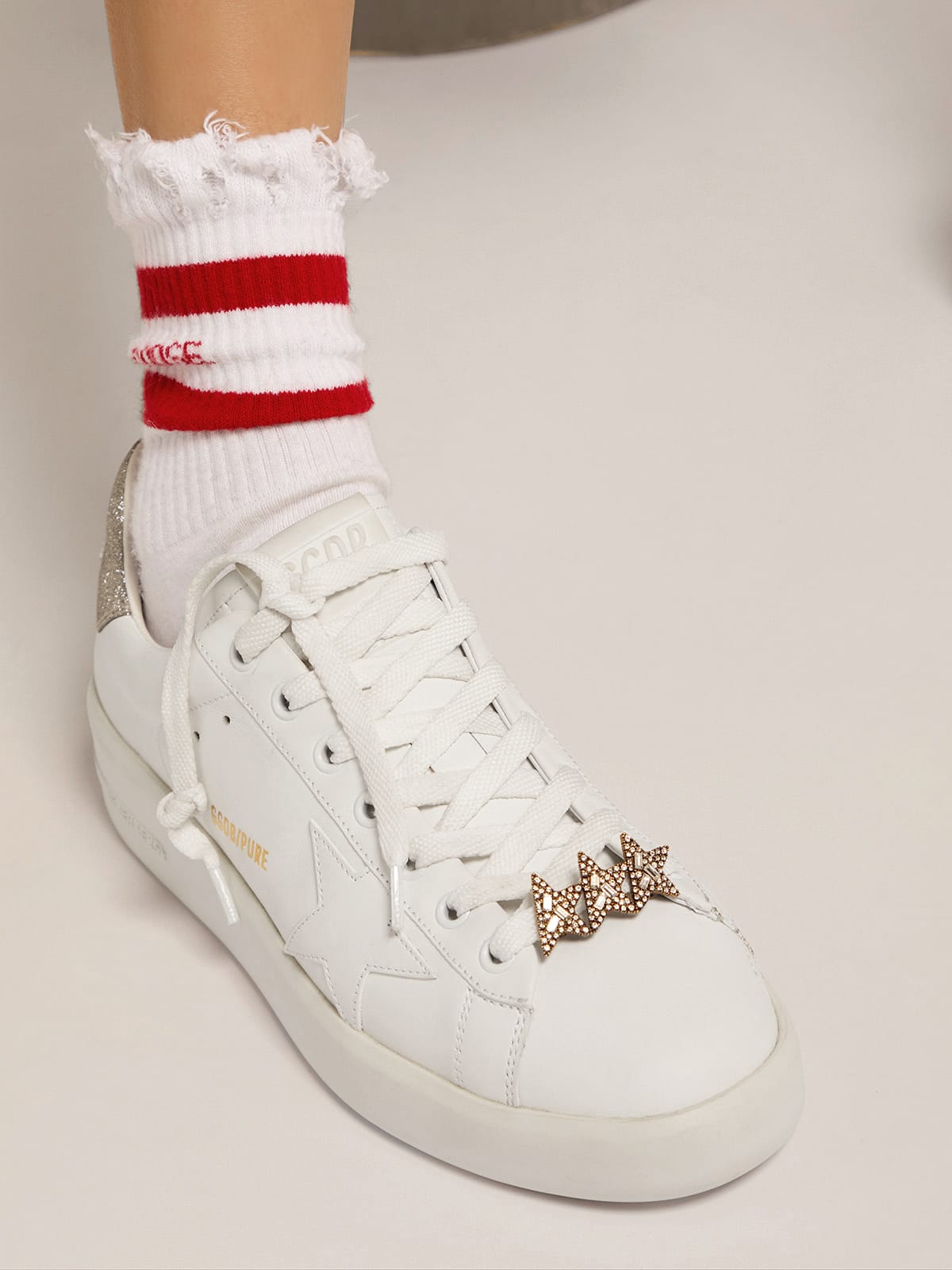 Golden Goose Lace accessory with three antique gold color stars with crystals
