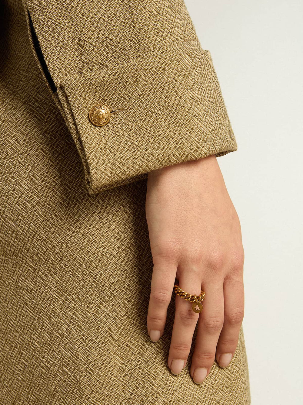 Golden Goose Ring in antique gold color with flexible links