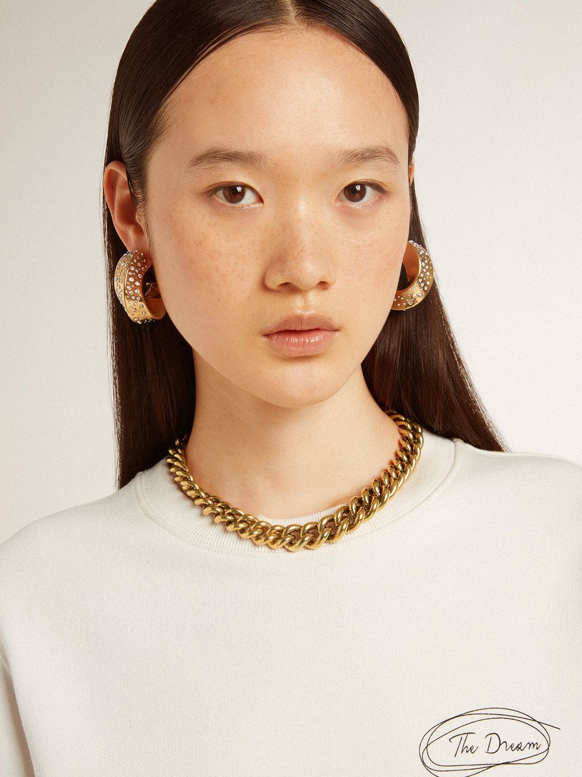 Golden Goose Necklace in antique gold decreasing chain with star-shaped clasp