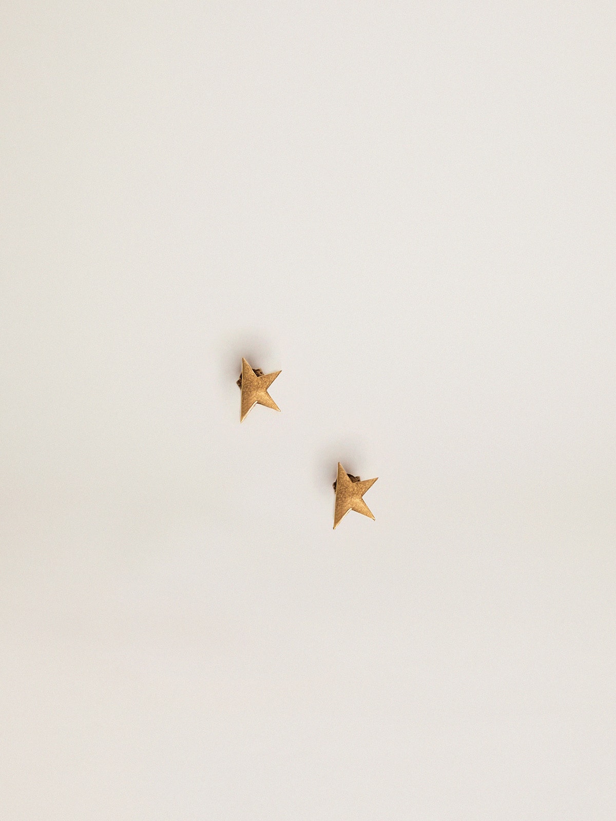 Golden Goose Women's stud earrings in antique gold color