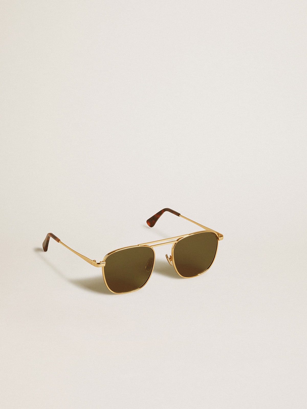 Golden Goose Aviator style sunglasses with gold frame and green lenses