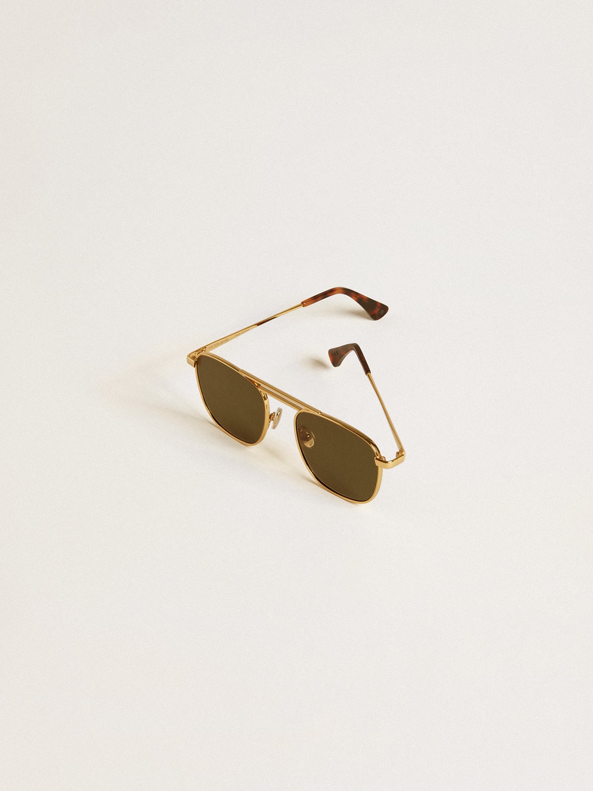 Golden Goose Aviator style sunglasses with gold frame and green lenses
