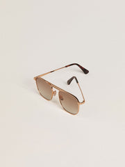 Golden Goose Aviator-style sunglasses with gold frame and beige lenses