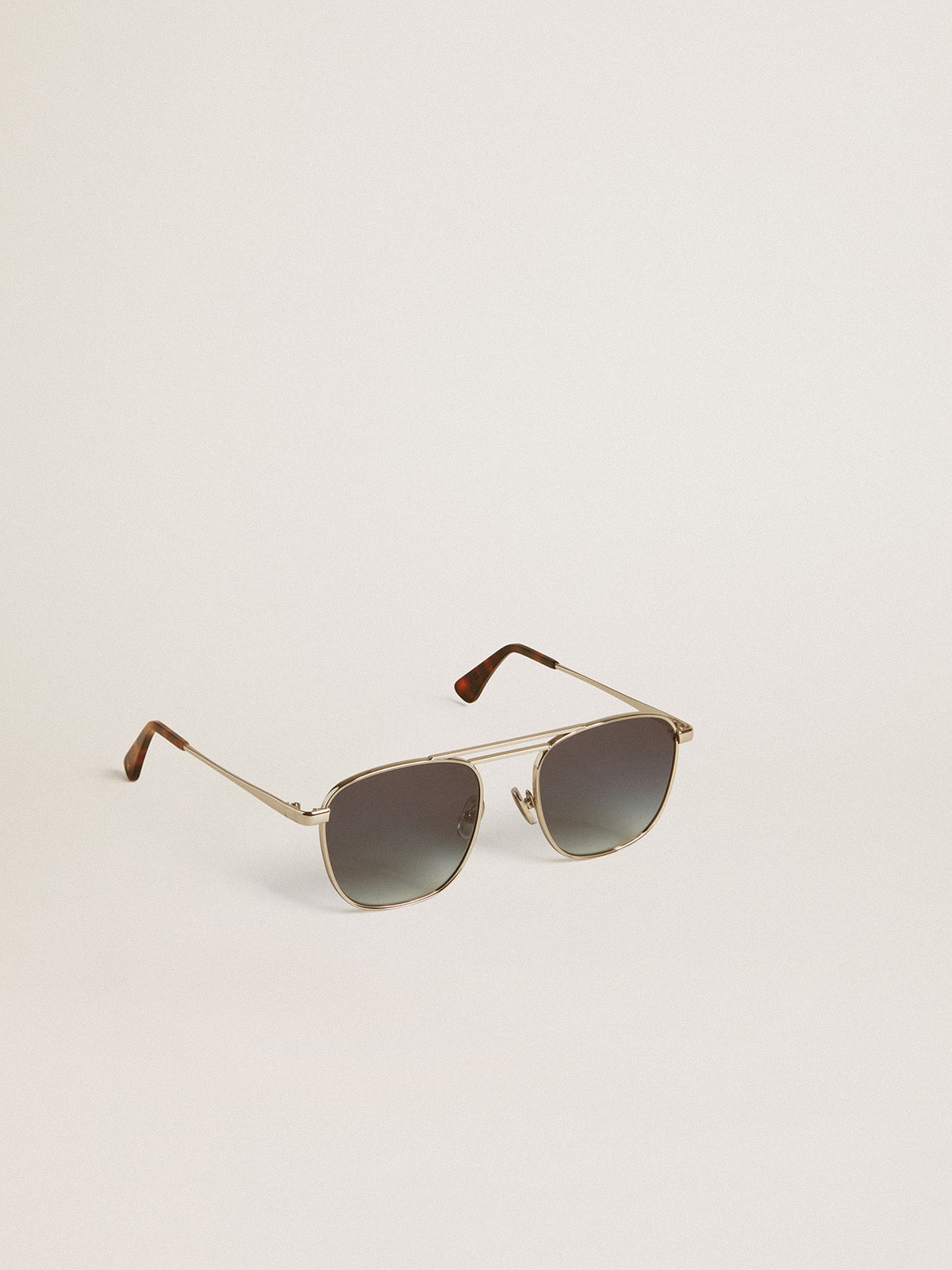 Golden Goose Aviator style sunglasses with silver frame and blue lenses