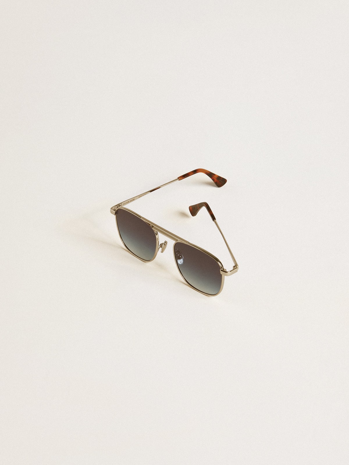 Golden Goose Aviator style sunglasses with silver frame and blue lenses
