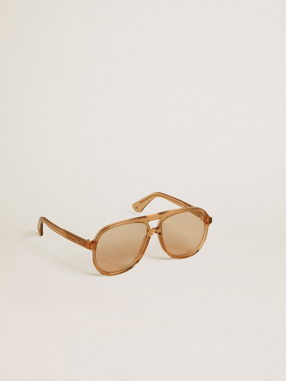 Golden Goose Aviator style sunglasses with honey-colored frame and lenses