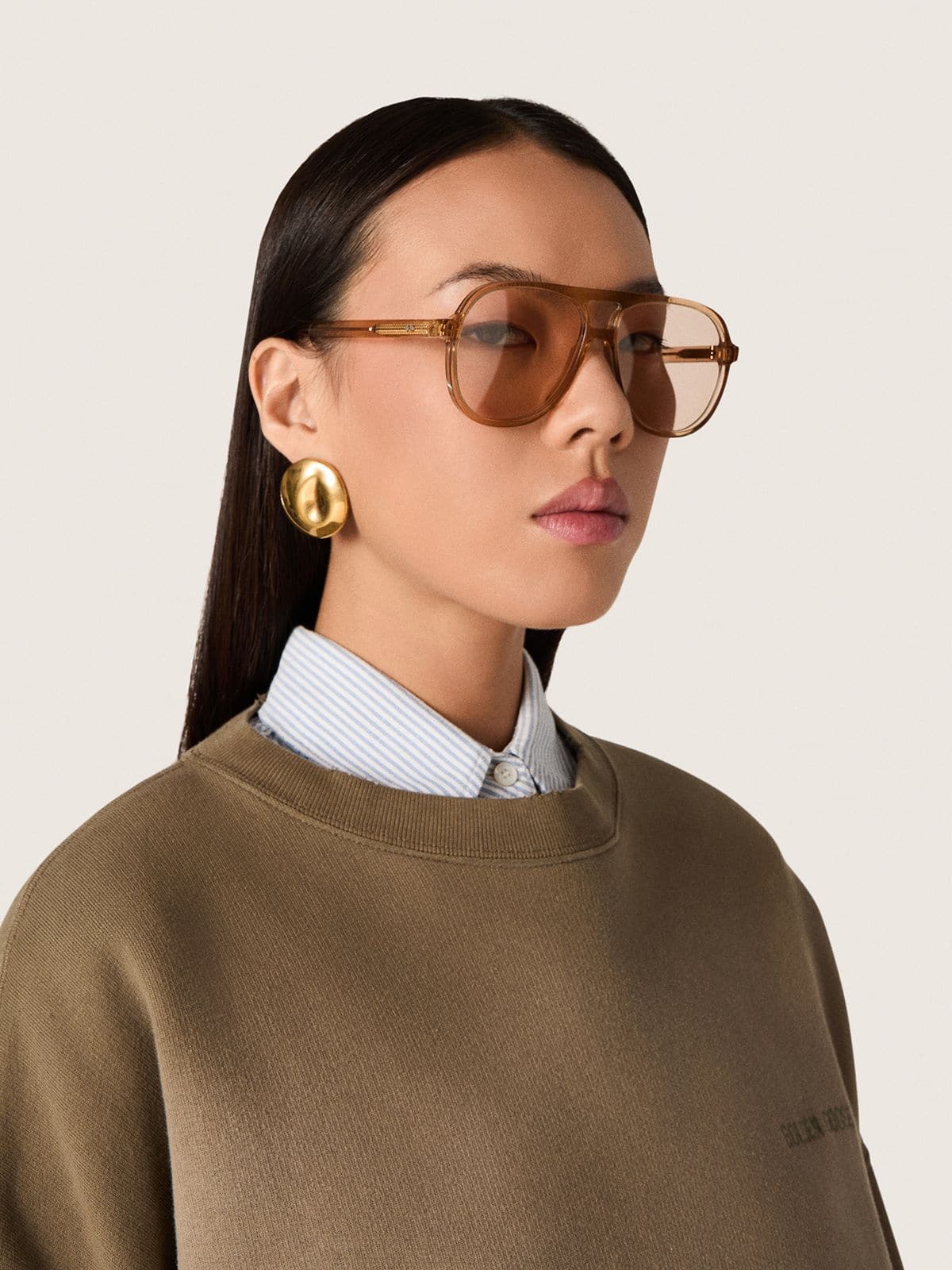 Golden Goose Aviator style sunglasses with honey-colored frame and lenses