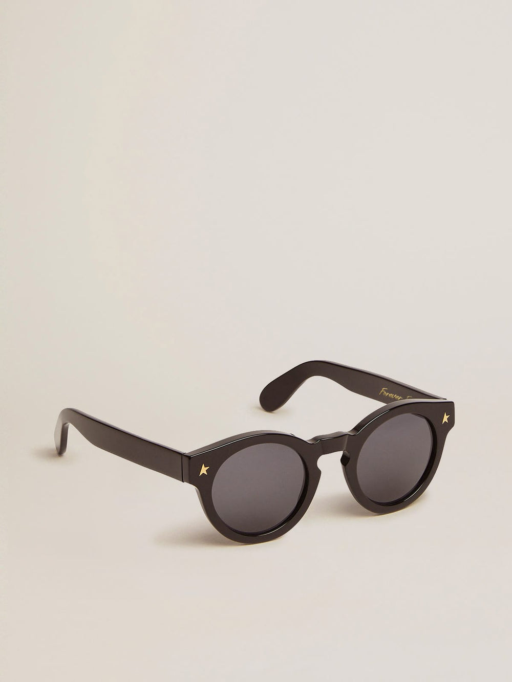 Golden Goose Sunframe Panthos model with black frame and gold details